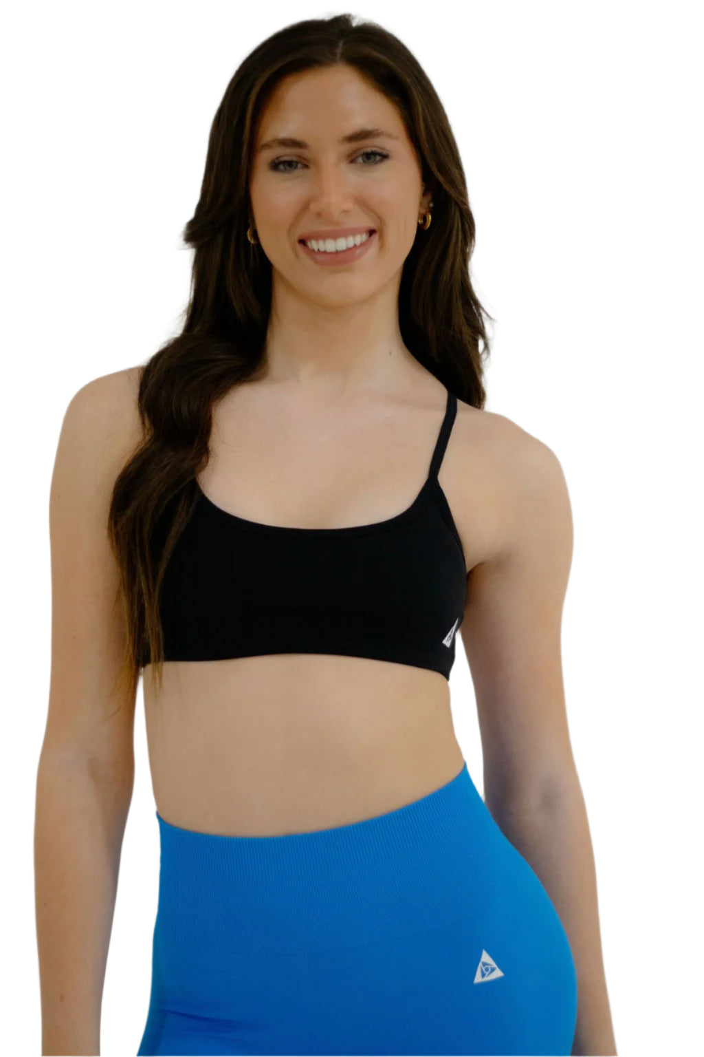A woman wearing a black sports bra with a double looped and criss-cross back design.
