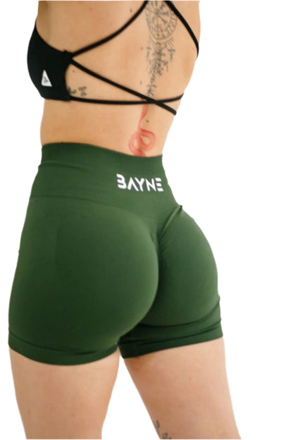 Green athletic shorts with 'BAYNE' branding on a white background